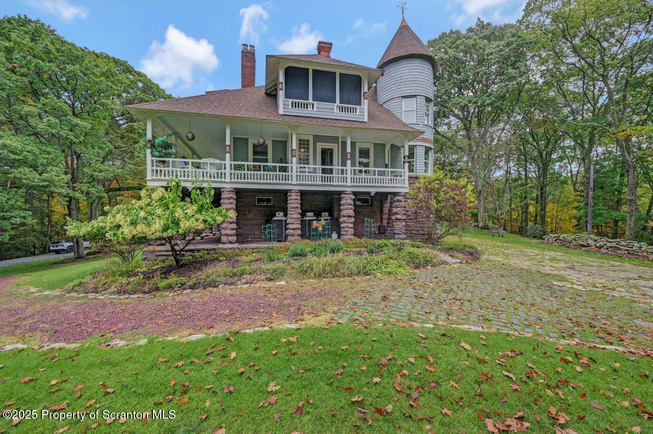 3360 Forest Road Wilkes Barre, PA 18706 - Photo 83 of 88 a front view of a house with a yard and potted plants