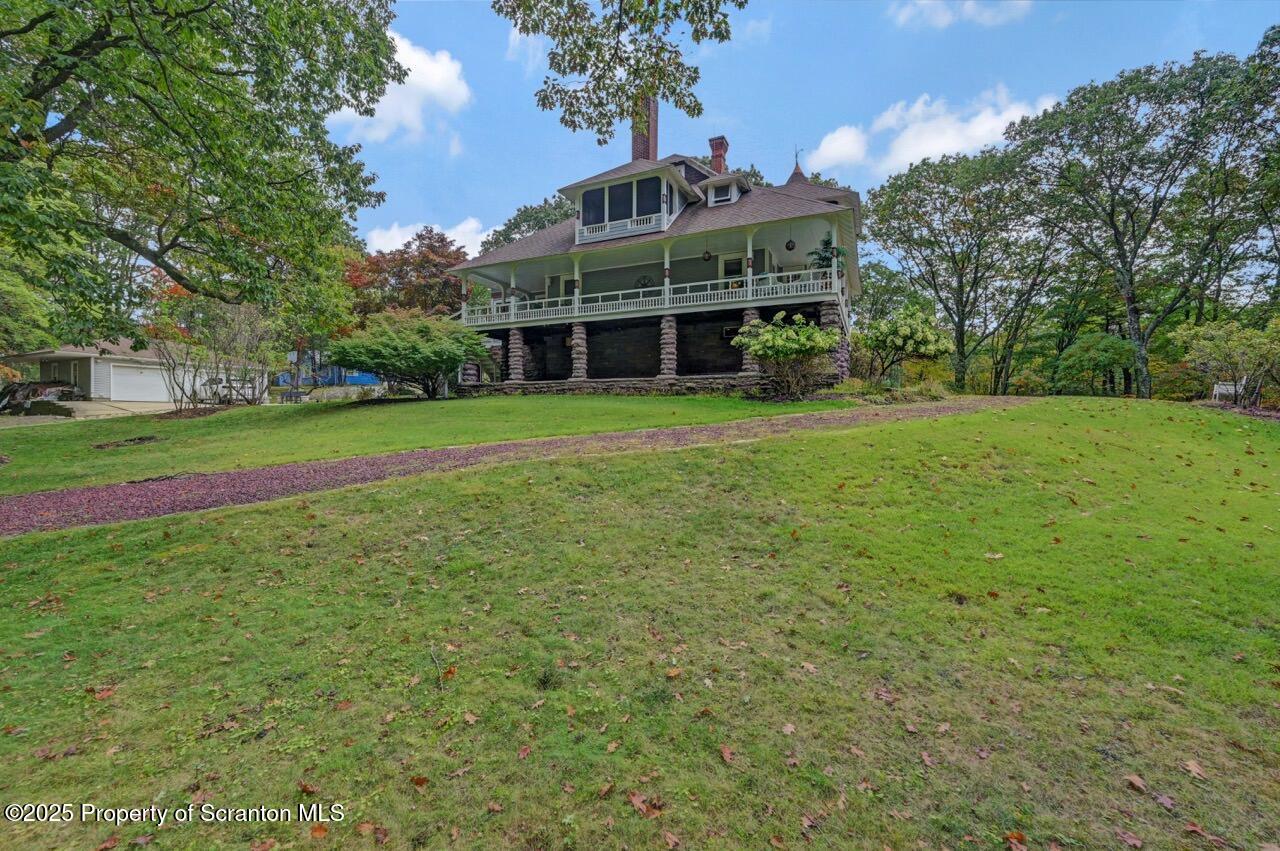 3360 Forest Road Wilkes Barre, PA 18706 - Photo 84 of 88 a view of a big house with a big yard and large trees