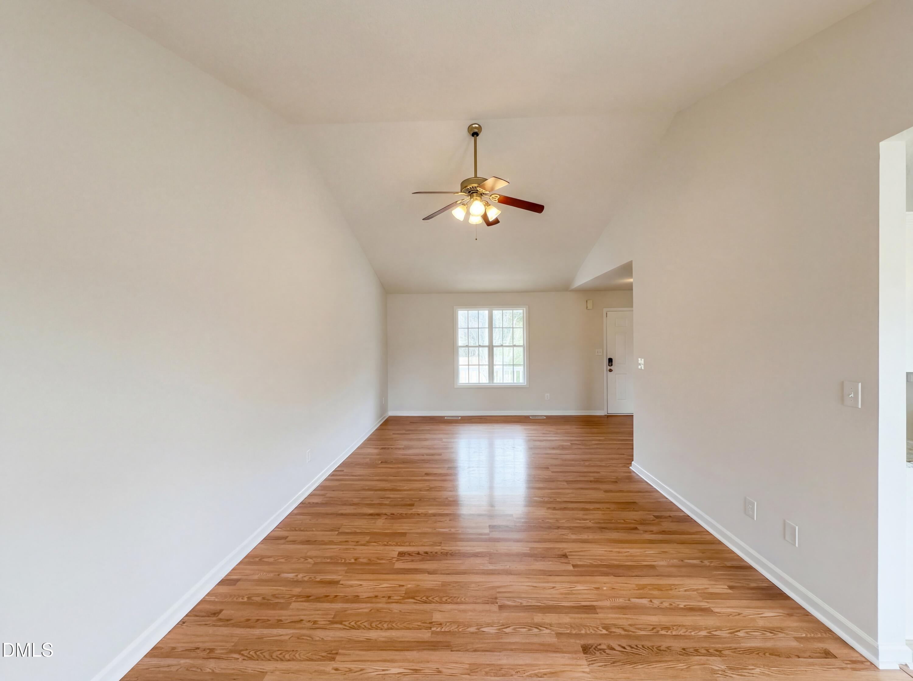 83 Eagle Rock Place Clayton, NC 27520 - Photo 3 of 16 a view of an empty room with wooden floor