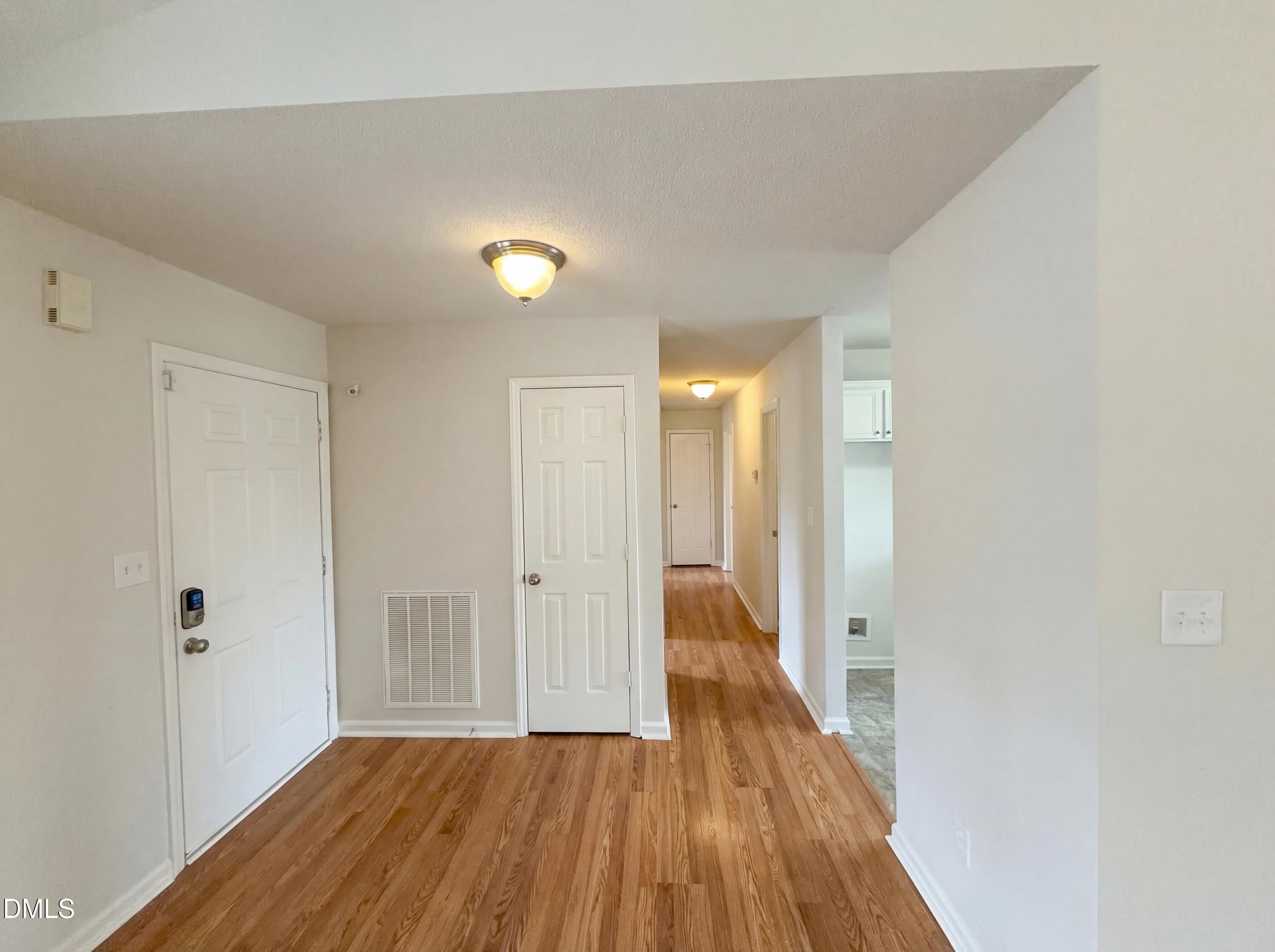 83 Eagle Rock Place Clayton, NC 27520 - Photo 8 of 16 a view of a hallway with wooden floor