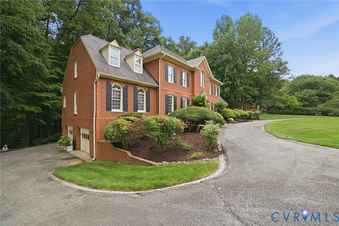 3950 Reeds Landing Circle Midlothian, VA 23113 - Photo 48 of 50 a front view of a house with a garden
