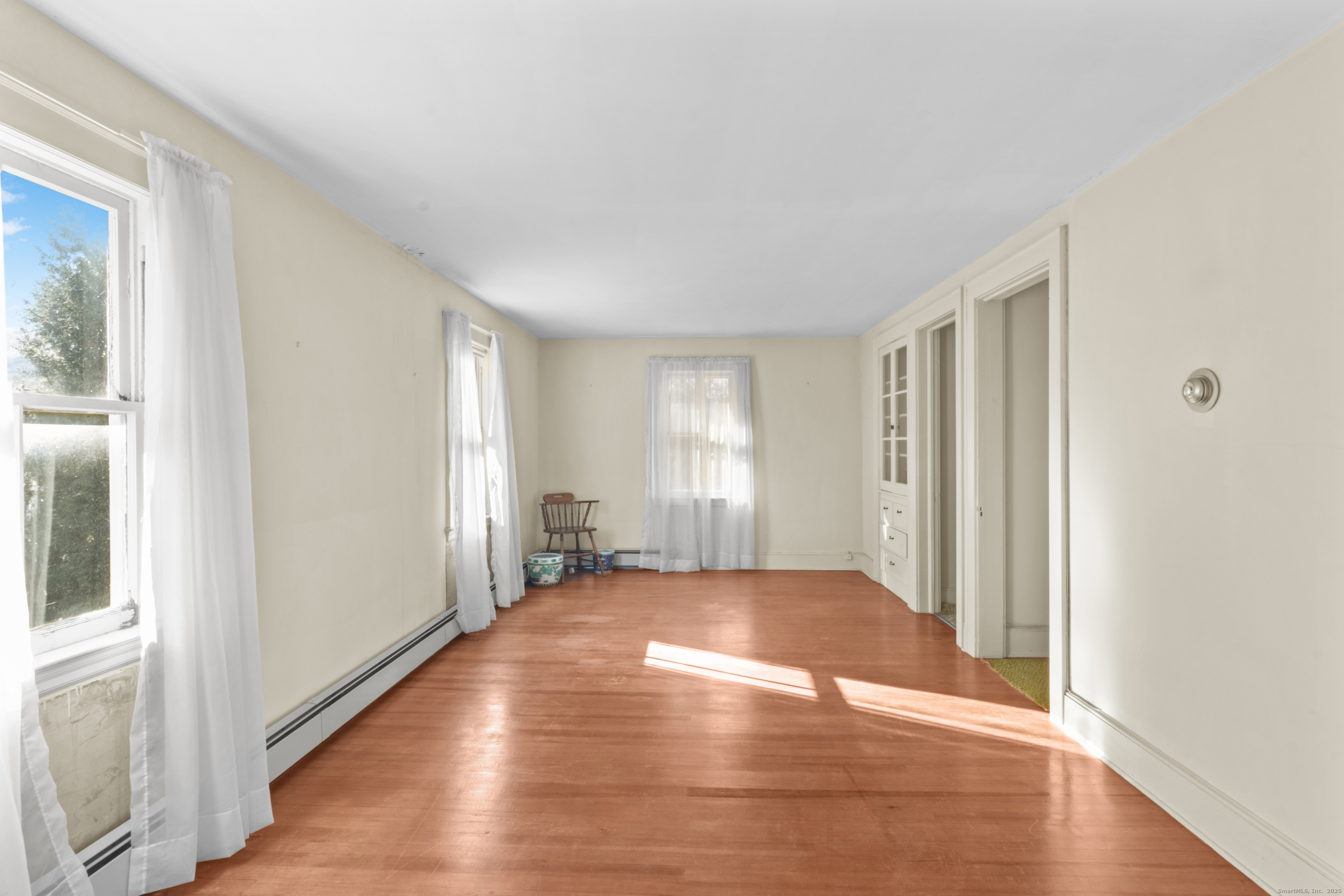 179 Verna Hill Road Fairfield, CT 06824 - Photo 23 of 36 a view of a livingroom with wooden floor and window