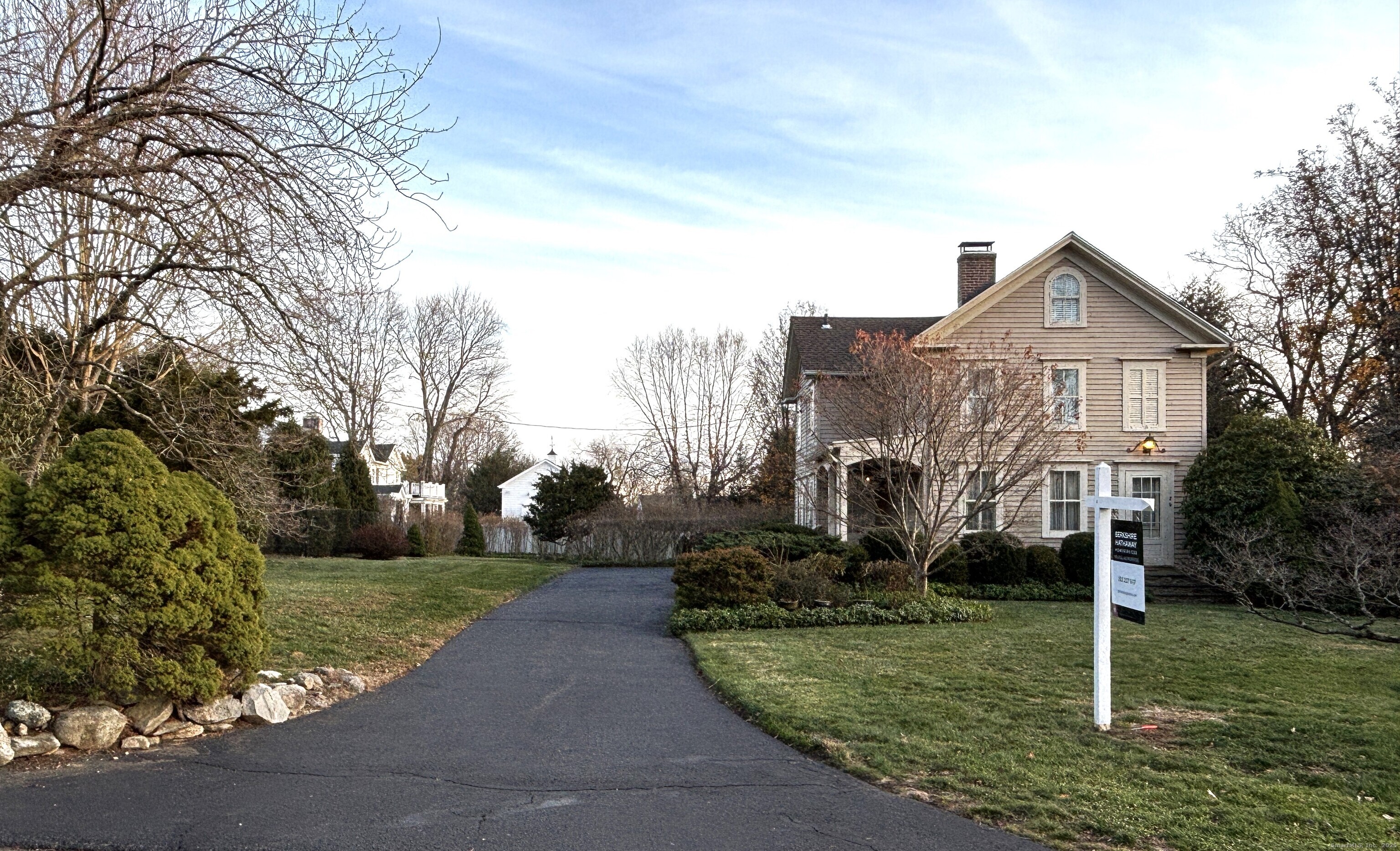 179 Verna Hill Road Fairfield, CT 06824 - Photo 3 of 36 a front view of a house with a yard and trees