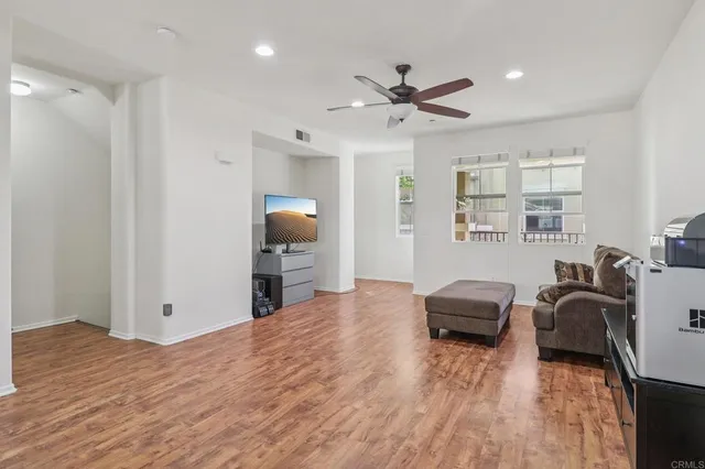 a view of a livingroom with furniture and wooden floor