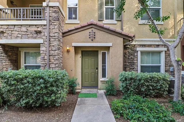 front view of a house with a small yard