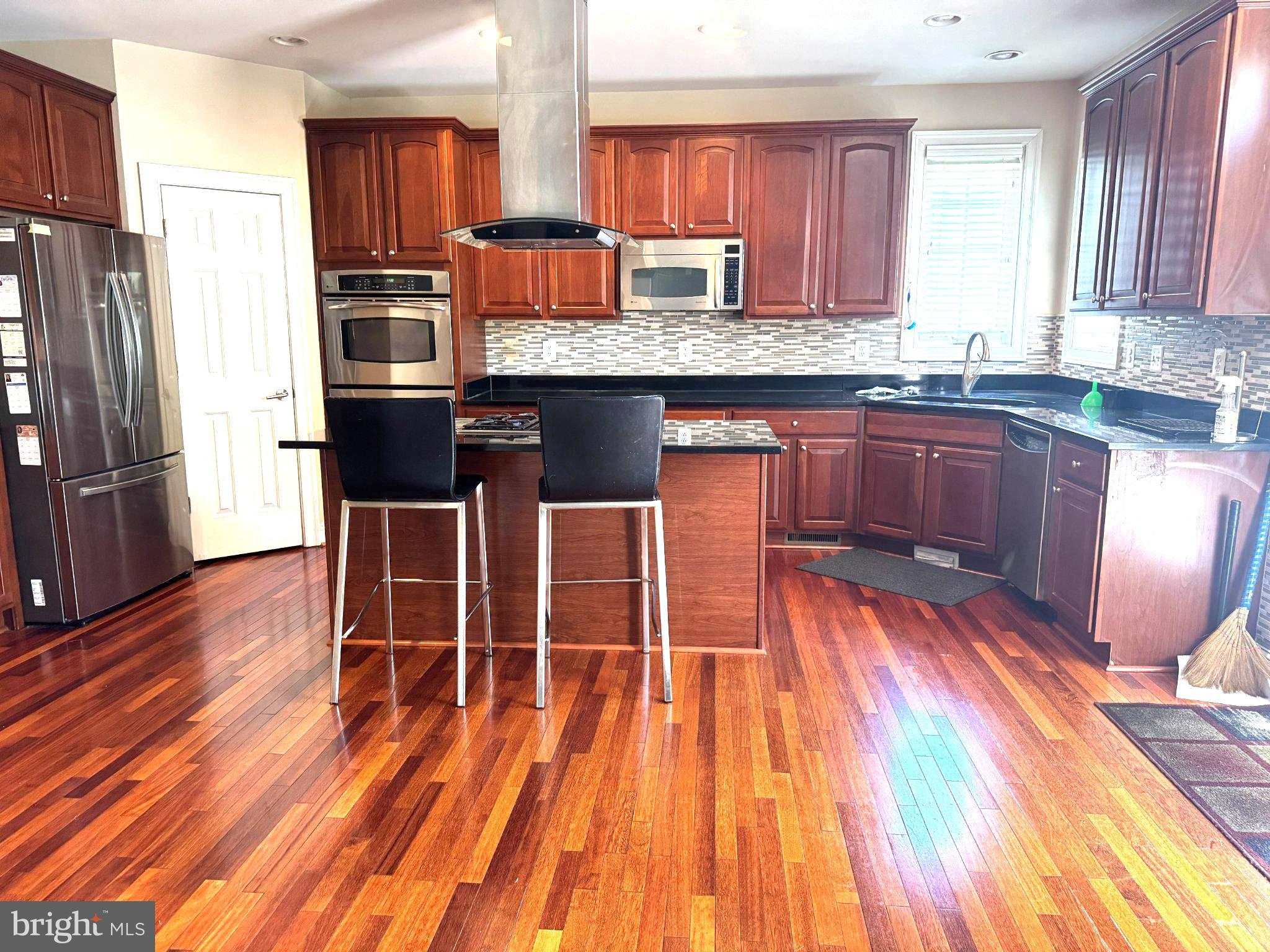 10815 Catron Road Perry Hall, MD 21128 - Photo 2 of 35 Modern kitchen with rich wood accents.