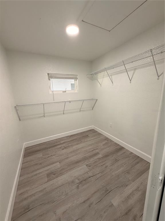 7513 Rustic Drive Tampa, FL 33634 - Photo 13 of 21 a view of a room with racks on the wall