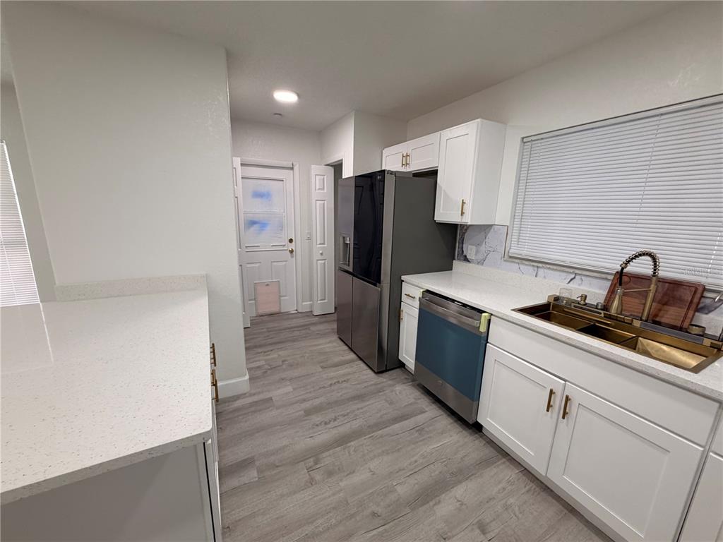 7513 Rustic Drive Tampa, FL 33634 - Photo 19 of 21 a kitchen with stainless steel appliances a refrigerator and a sink
