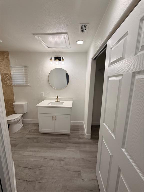 7513 Rustic Drive Tampa, FL 33634 - Photo 21 of 21 a view of a bathroom with a sink and mirror