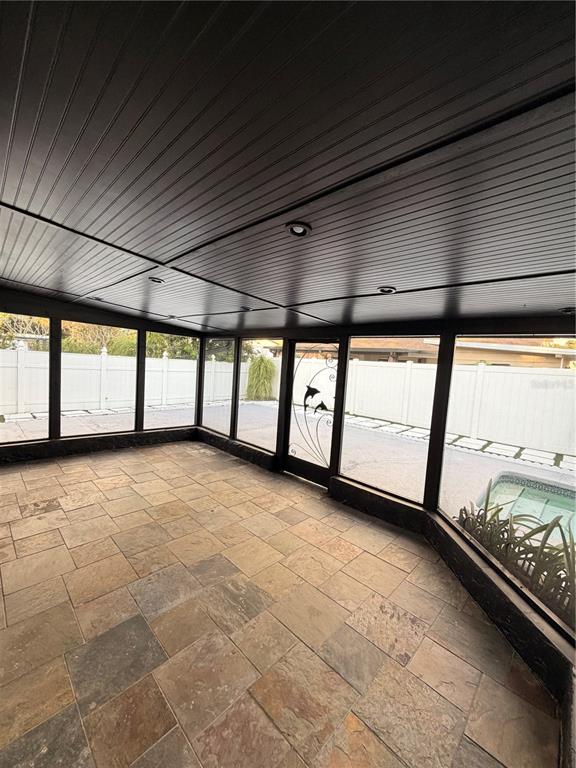 7513 Rustic Drive Tampa, FL 33634 - Photo 7 of 21 a view of an empty room with a window