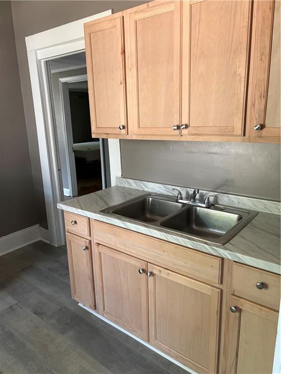 548 Colquitt Street Macon, GA 31206 - Photo 2 of 6 a kitchen with stainless steel appliances white cabinets and a sink