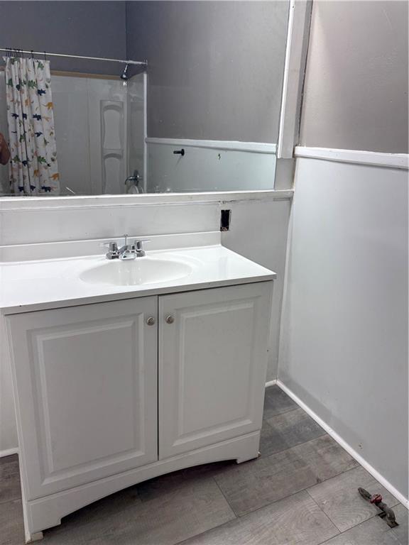 548 Colquitt Street Macon, GA 31206 - Photo 3 of 6 a bathroom with a sink and a mirror