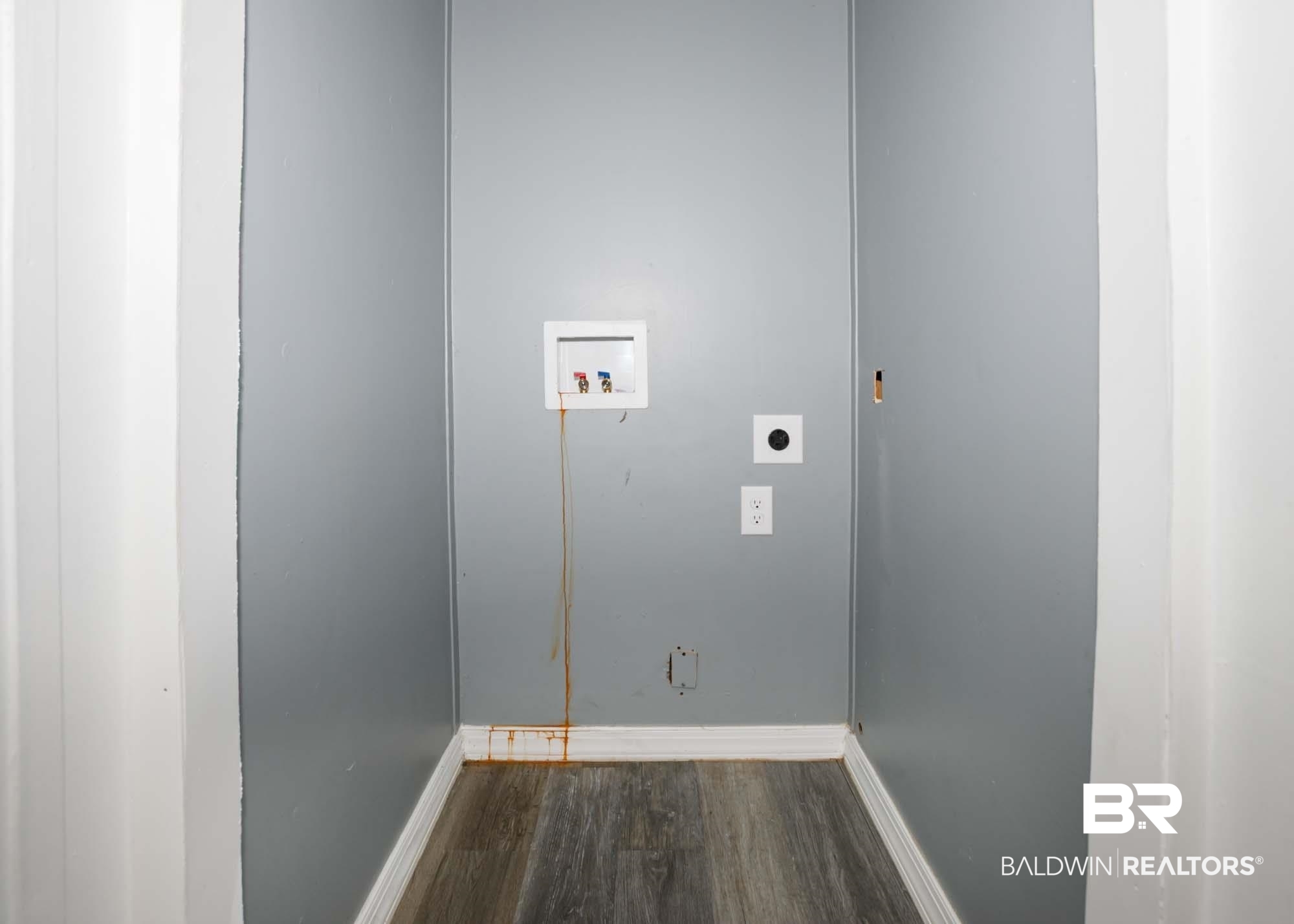 11998 Workman Avenue Foley, AL 36535 - Photo 29 of 59 Washroom featuring electric dryer hookup, washer hookup, and dark wood-type flooring