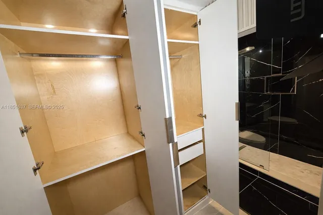 a room with water heater and white walls