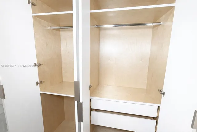 a bathroom with a mirror and a sink