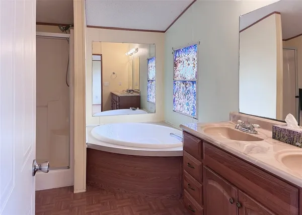 a view of a small space with wooden floor and a window