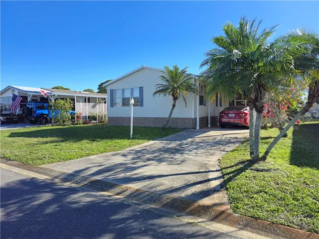 a house with palm tree in front of it