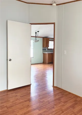 an empty room and wooden floor