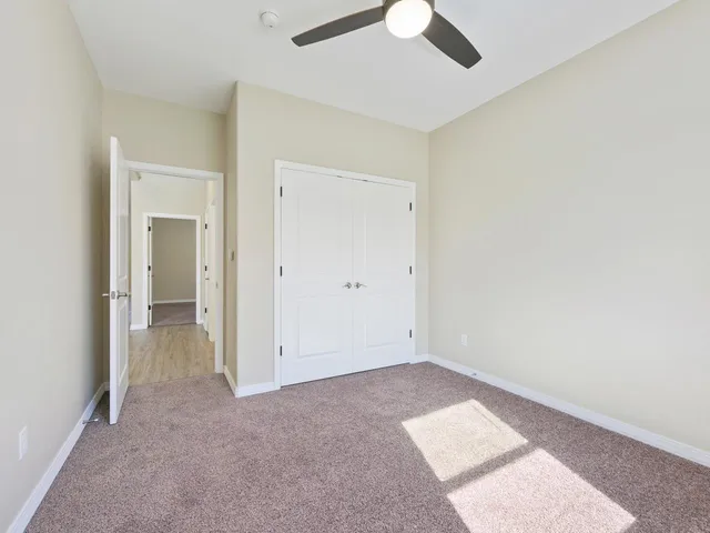 a utility room with granite countertop cabinets washer and dryer