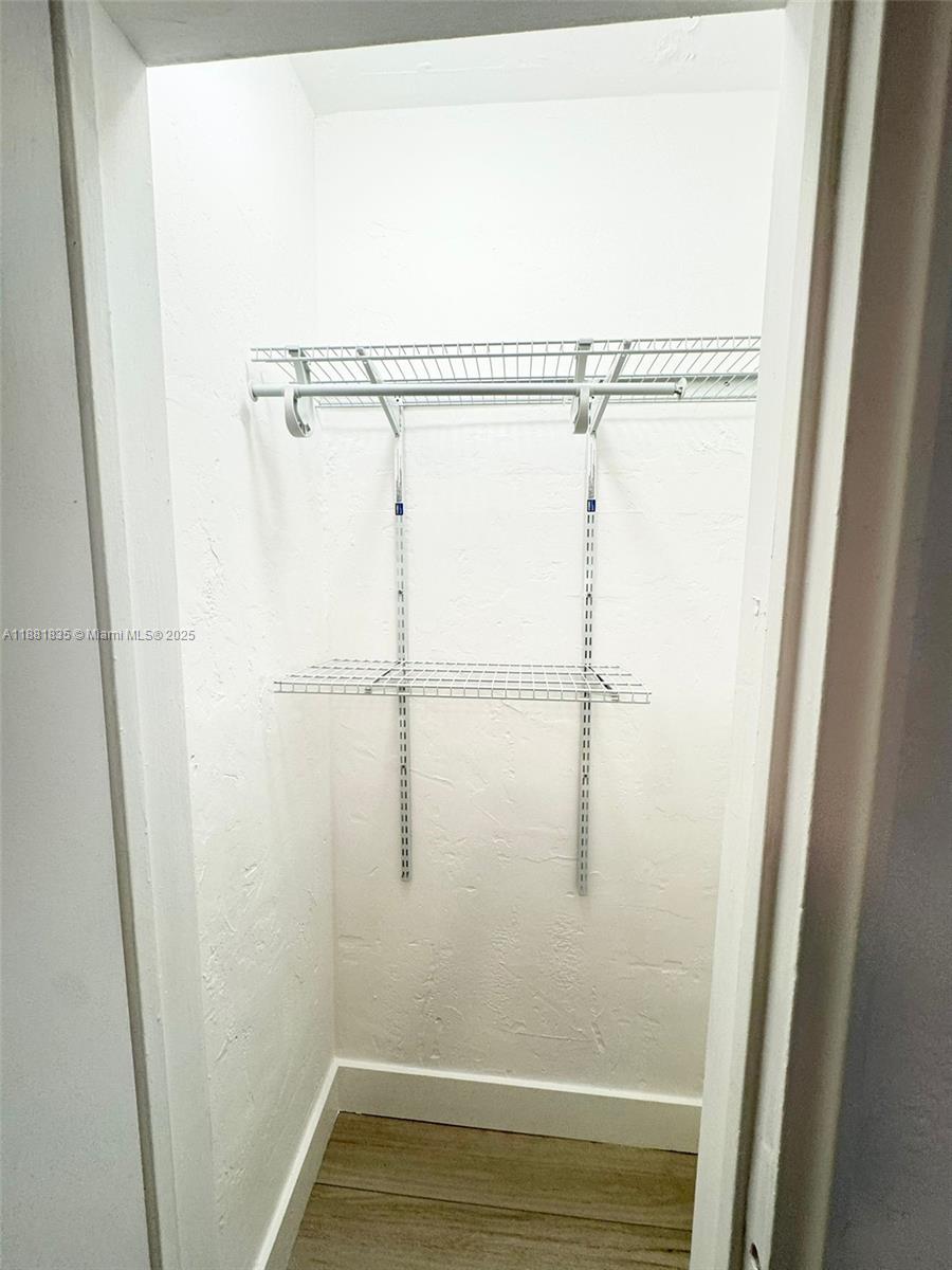 7435 Byron Avenue, Unit 2 Miami Beach, FL 33141 - Photo 27 of 35 a bathroom with a glass shower door