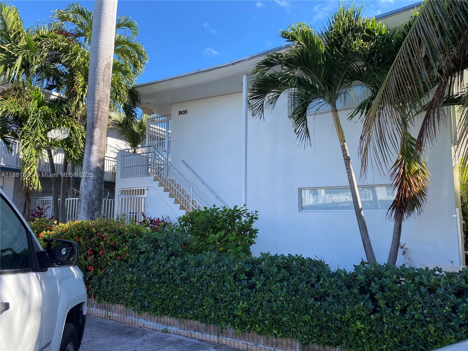7435 Byron Avenue, Unit 2 Miami Beach, FL 33141 - Photo 28 of 35 a view of a palm trees front of a house