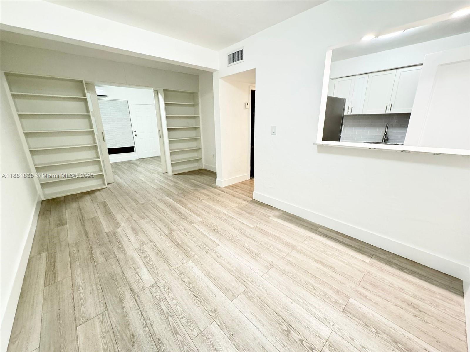 7435 Byron Avenue, Unit 2 Miami Beach, FL 33141 - Photo 6 of 35 a view of an empty room with closet