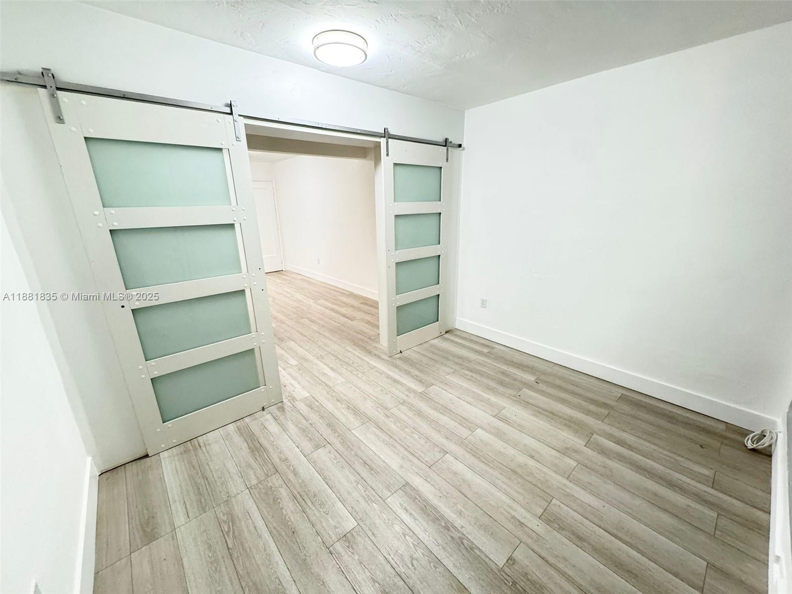 7435 Byron Avenue, Unit 2 Miami Beach, FL 33141 - Photo 10 of 35 a view of an empty walk in closet