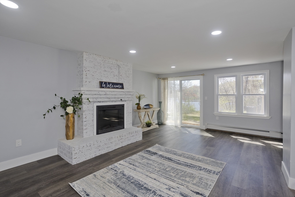 138 Stapleton Road Springfield, MA 01109 - Photo 2 of 38 a living room with furniture and a fireplace
