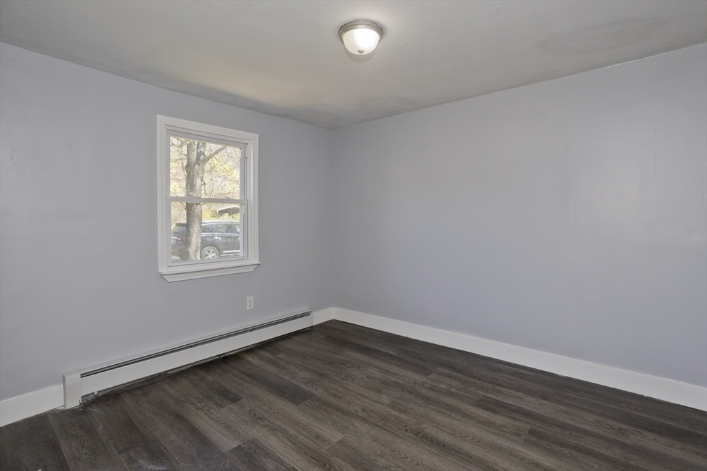 138 Stapleton Road Springfield, MA 01109 - Photo 29 of 38 wooden floor in an empty room with a window