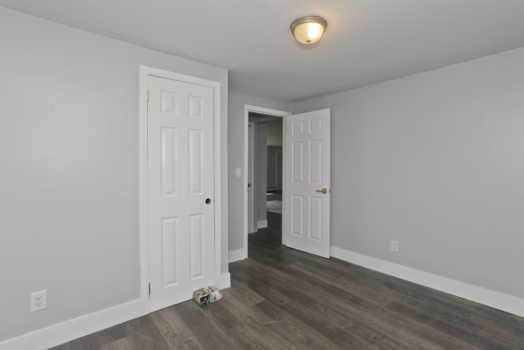 138 Stapleton Road Springfield, MA 01109 - Photo 31 of 38 an empty room with wooden floor and closet