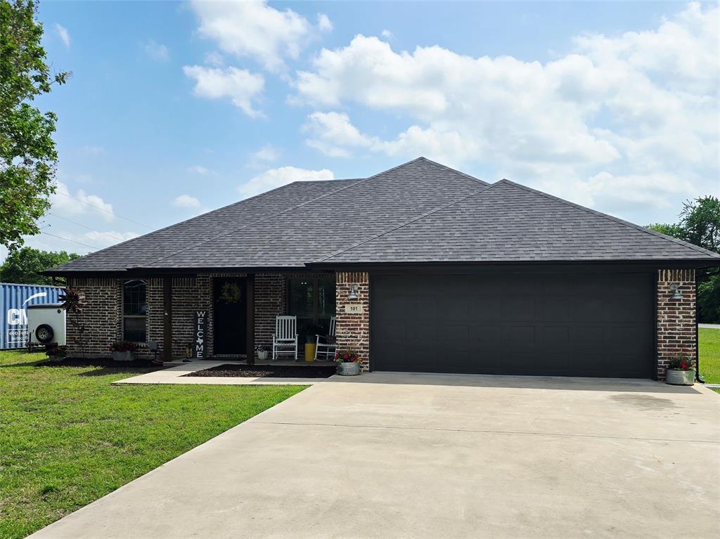 101 East Whitewright Road Savoy, TX 75479 - Photo 2 of 19 Extra wide and long driveway for additional parking or your big 4x4 lifted truck!