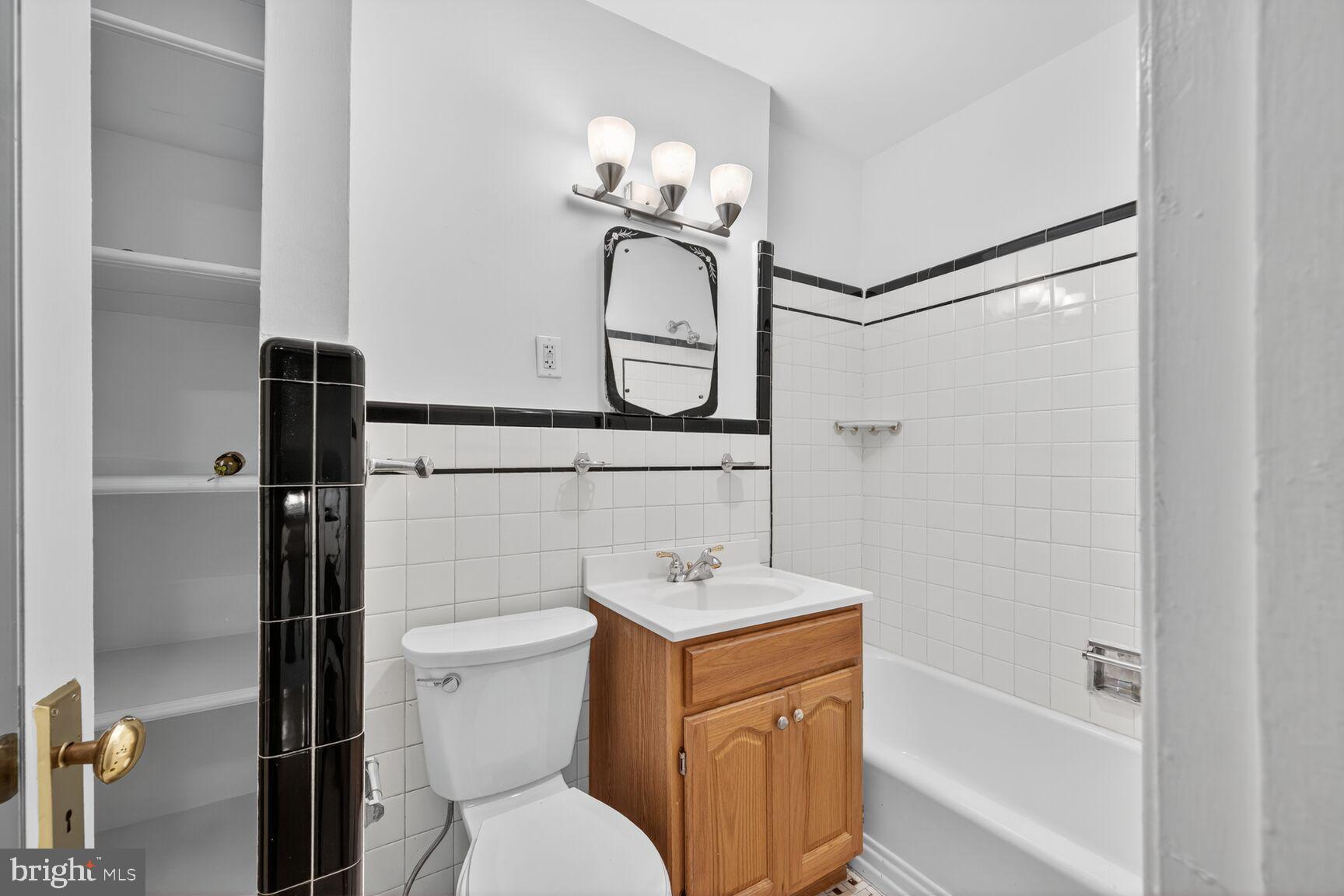3625 Jenifer Street Northwest Washington, DC 20015 - Photo 11 of 30 Charming bathroom with classic tile accents.