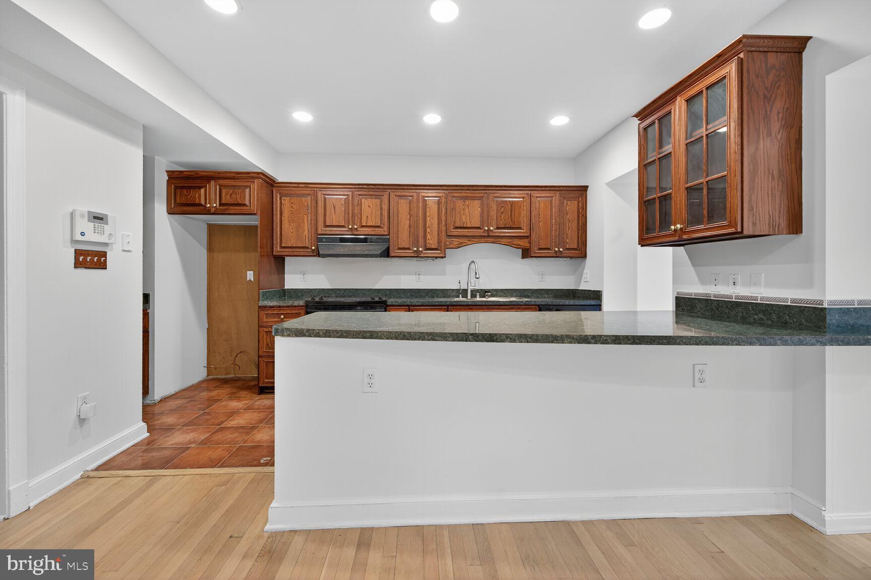 3625 Jenifer Street Northwest Washington, DC 20015 - Photo 7 of 30 Modern kitchen with elegant wood cabinetry.
