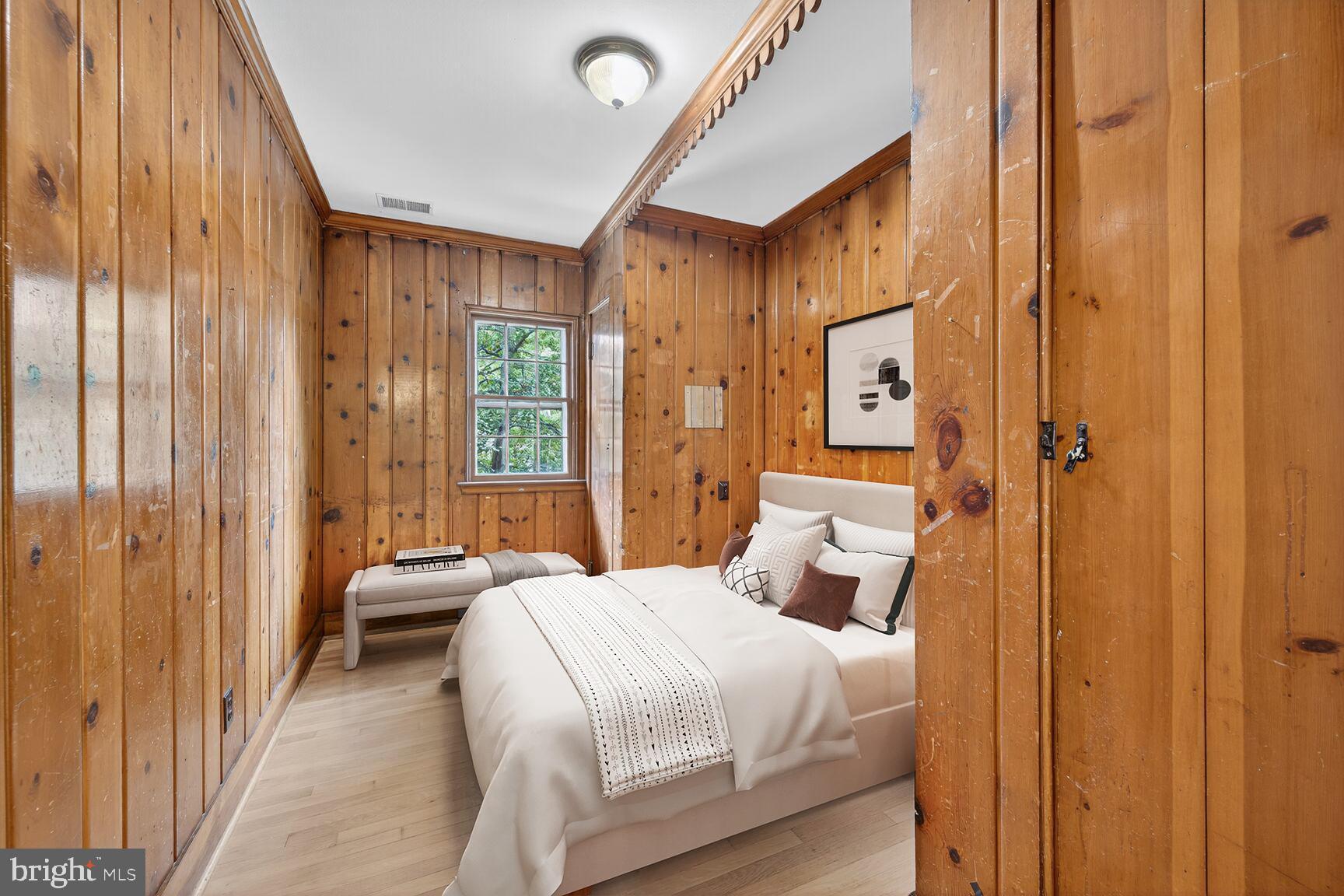 3625 Jenifer Street Northwest Washington, DC 20015 - Photo 10 of 30 Bedroom 1. Cozy retreat with warm wooden accents.