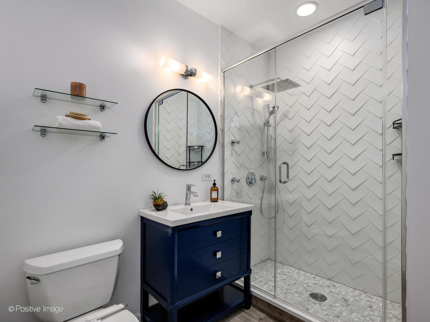657 West Fulton Street, Unit 708 Chicago, IL 60661 - Photo 21 of 22 a bathroom with a sink mirror vanity and a toilet