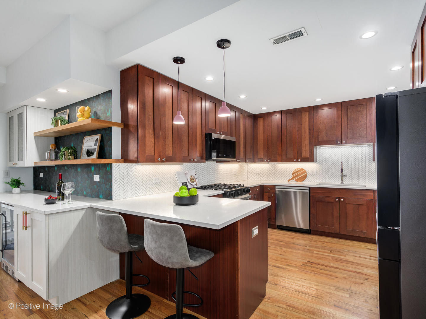 657 West Fulton Street, Unit 708 Chicago, IL 60661 - Photo 6 of 22 a kitchen with kitchen island granite countertop a sink cabinets and wooden floor