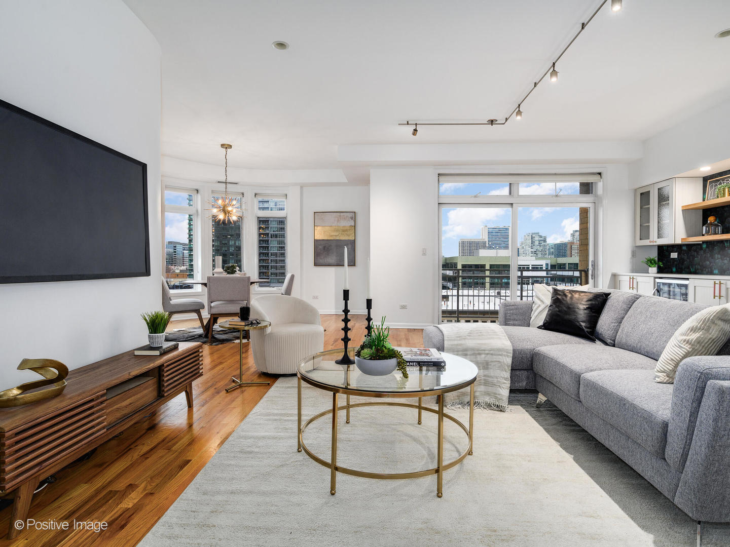657 West Fulton Street, Unit 708 Chicago, IL 60661 - Photo 8 of 22 a living room with fireplace furniture and a flat screen tv