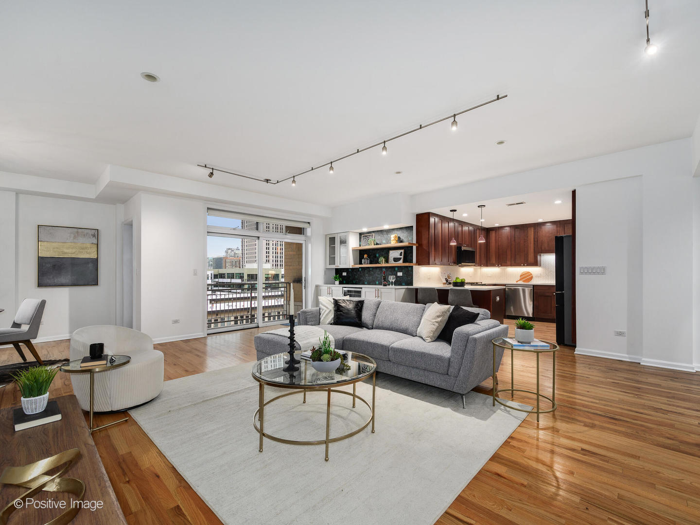 657 West Fulton Street, Unit 708 Chicago, IL 60661 - Photo 10 of 22 a living room with furniture and a wooden floor
