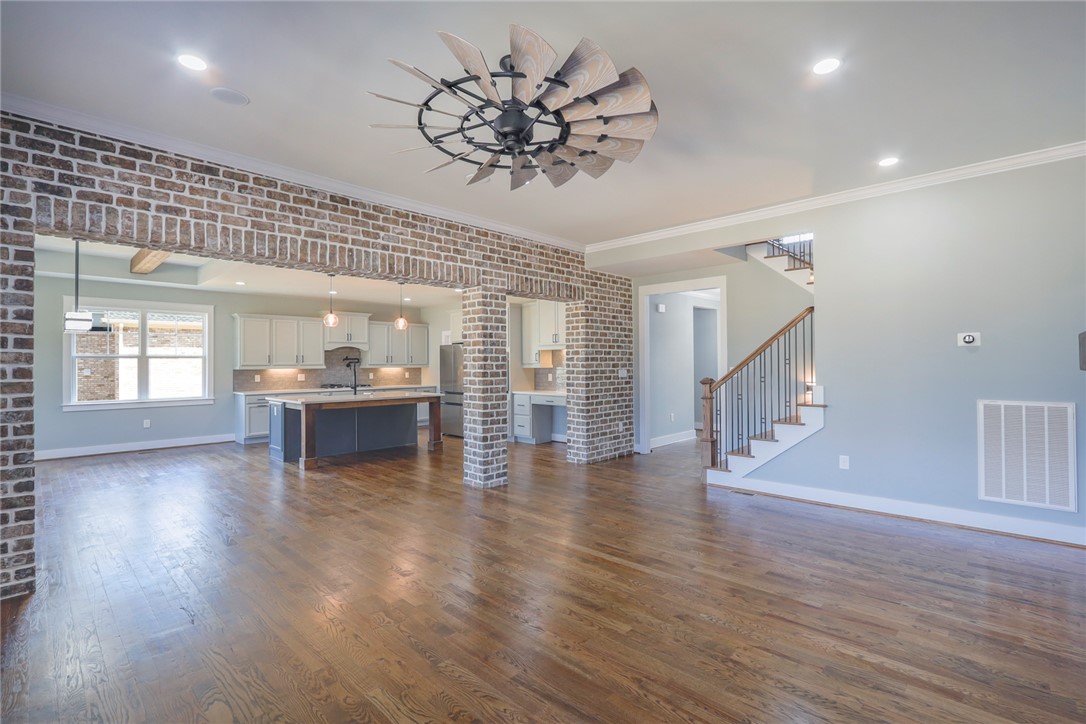 2403 Warriors Path Anderson, SC 29621 - Photo 50 of 50 This inviting home offers an open floor plan with hardwood floors and exposed brick accents.