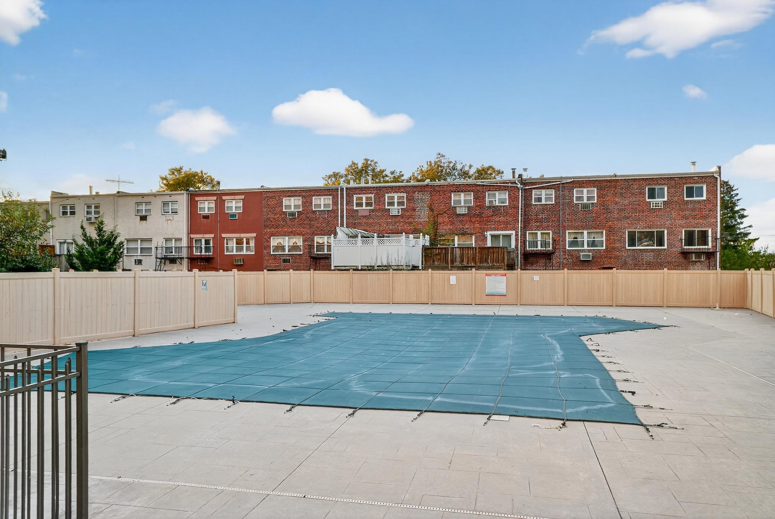 1225 John F. Kennedy Boulevard, Unit 12K Bayonne, NJ 07002 - Photo 18 of 18 a view of building with a swimming pool