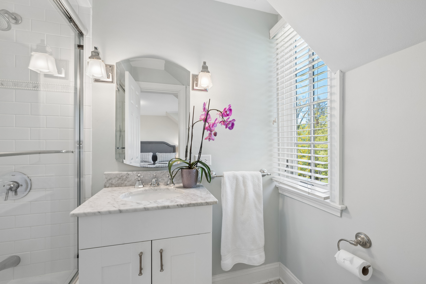 936 Sunset Road Winnetka, IL 60093 - Photo 34 of 50 a bathroom with a granite countertop sink and a mirror