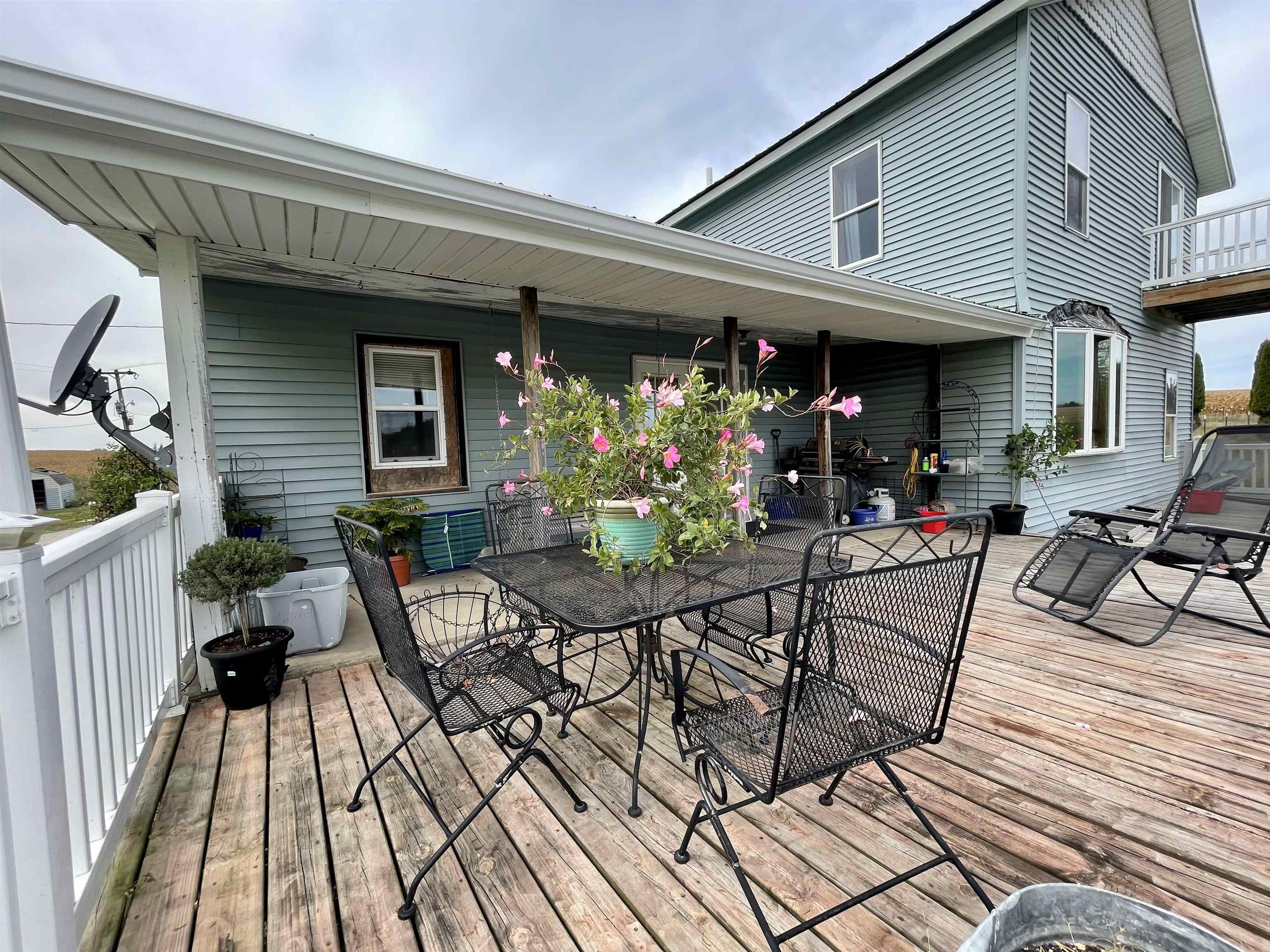 9822 Mill Road Mount Carroll, IL 61053 - Photo 6 of 42 a view of a chairs and table in a patio