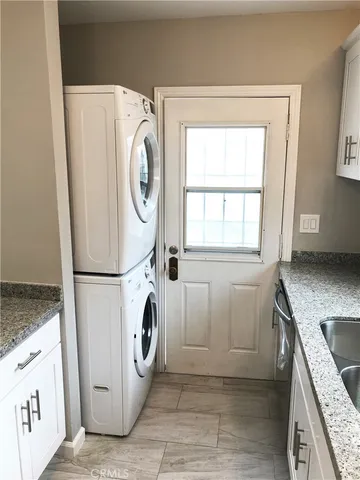 a kitchen with wooden floors and a stove top oven