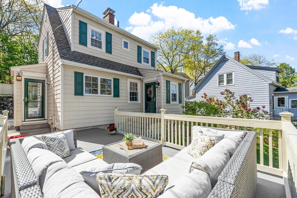 25 Naples Road Melrose, MA 02176 - Photo 26 of 36 a view of a house with couches chairs and wooden floor