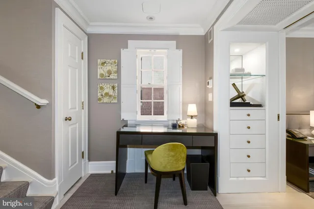 a view of a chair and a mirror in a room