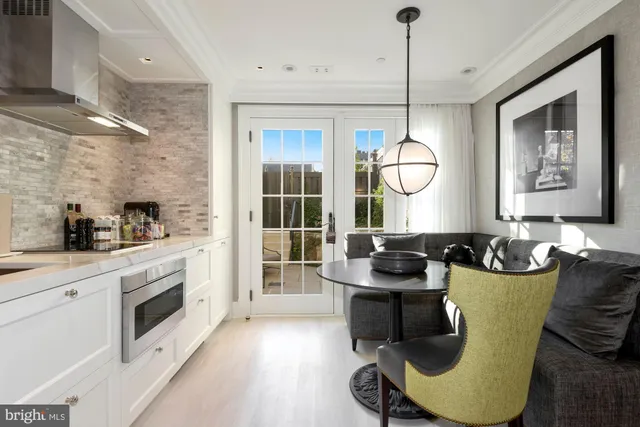 a kitchen with a sink cabinets and window