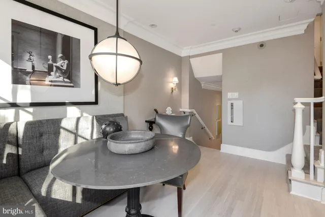 a dining room with furniture and window