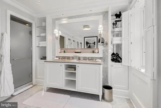 a en suite bathroom with a sink shower and a mirror