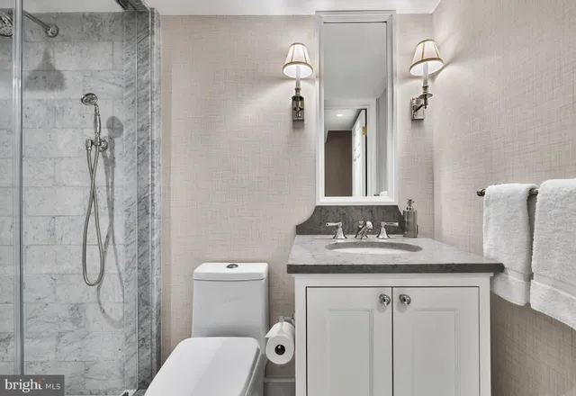 a bathroom with a tub sink and shower