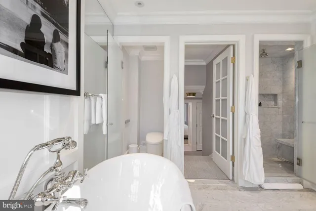 a view of a hallway with washer and dryer
